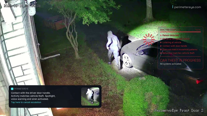 The person running away from the car, fully lit by the searchlight